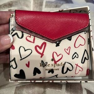 Kate Spade: Beautiful Kate Spade wallet with red and black accents. New in box.
